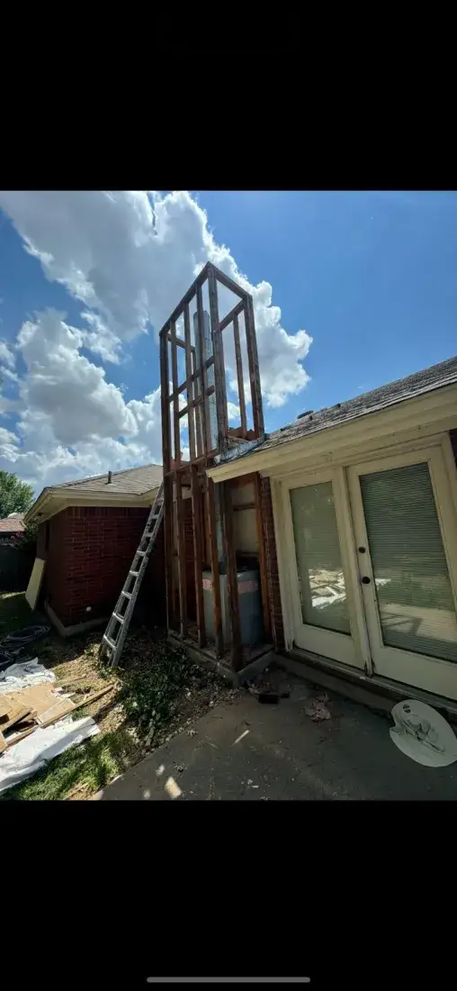 Before chimney chase rebuild after damaged siding removal